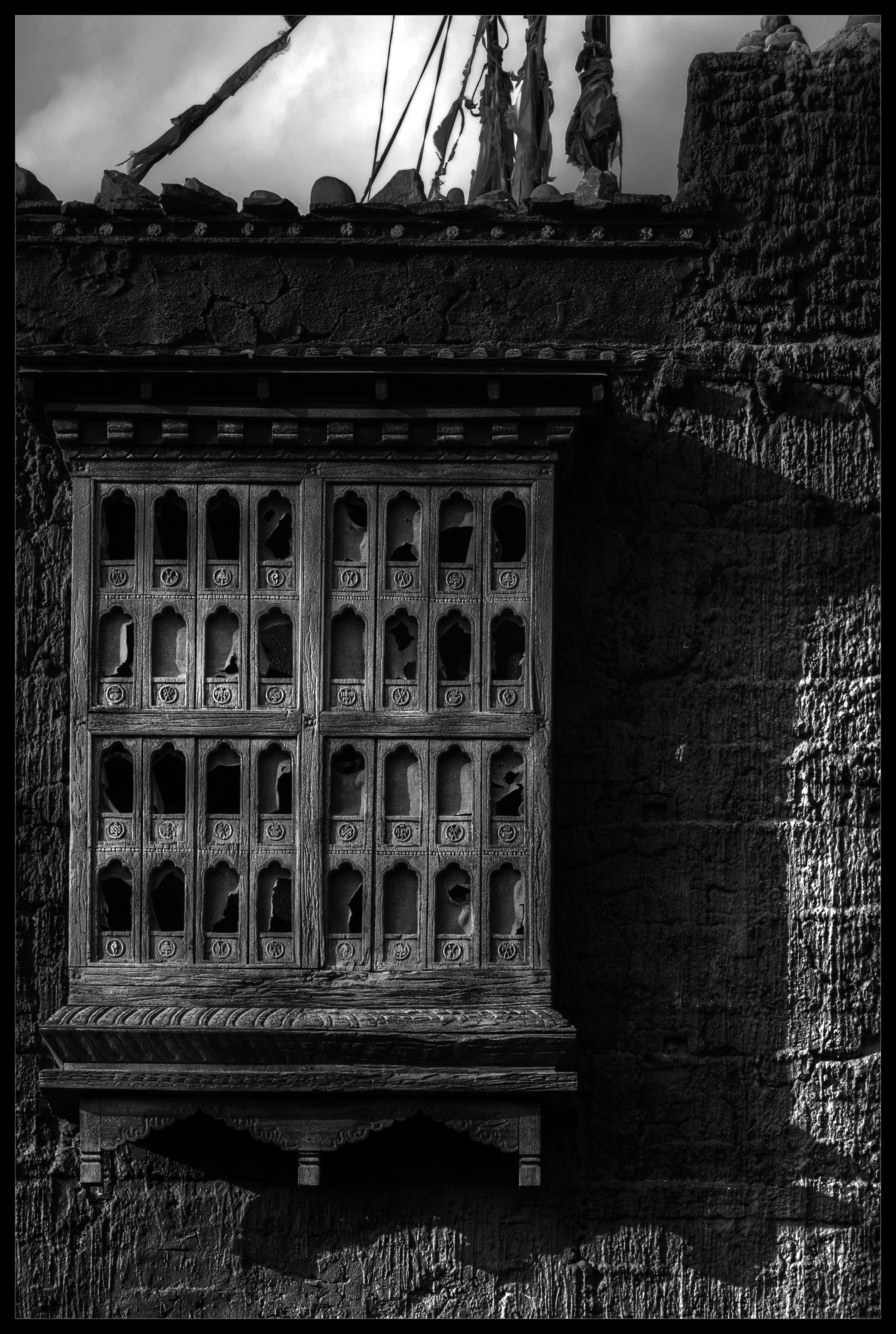 A black-and-white architectural photograph of wall textures.